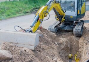 mini excavator road works internet power supply 123921386